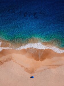 Ocean waves wash onto a sandy beach.