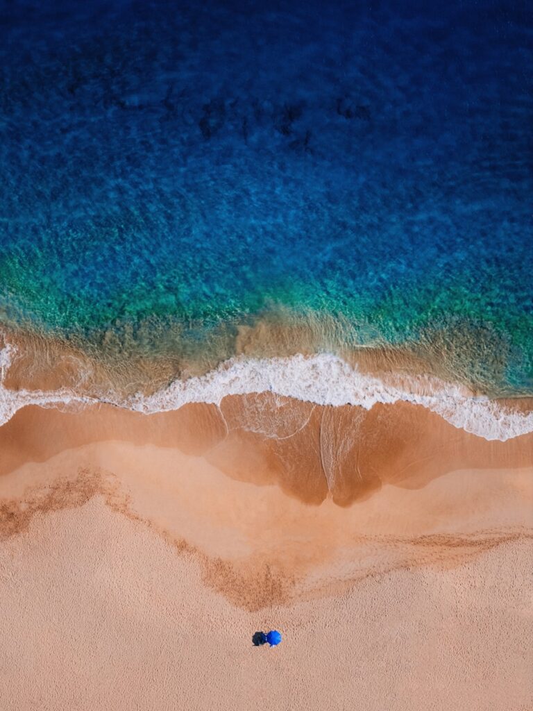 Ocean waves wash onto a sandy beach.